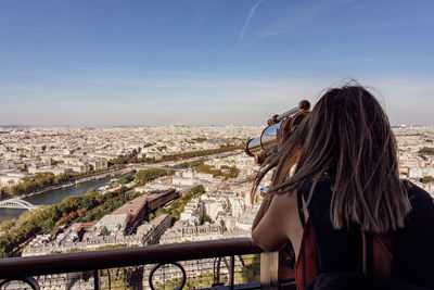 Woman looking at view of cityscape