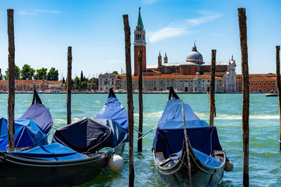 Panoramic view of boats moored in canal