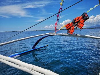 View of boat in sea against sky