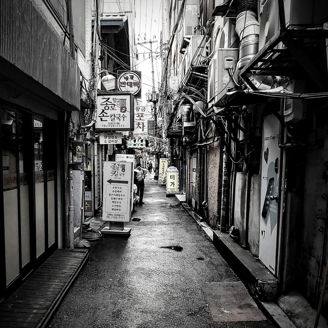 road, alley, street, architecture, infrastructure, urban area, built structure, building exterior, black, the way forward, monochrome, white, black and white, city, building, monochrome photography, lane, darkness, day, snapshot, narrow, residential district, no people, outdoors, footpath