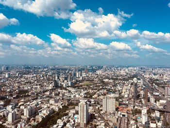 High angle view of city against cloudy sky