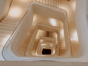 Directly below shot of spiral staircase of building