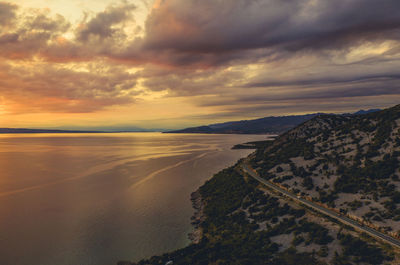 Scenic view of beach against sky during sunset