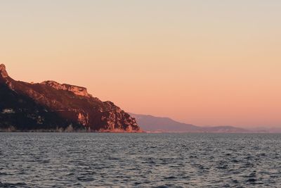 Scenic view of sea against clear sky during sunset