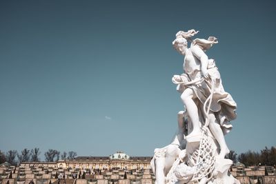 Statue of angel against clear sky