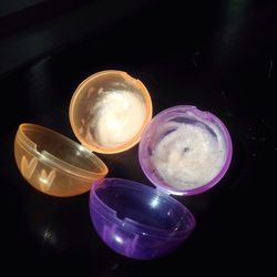 Close-up of illuminated candles on table