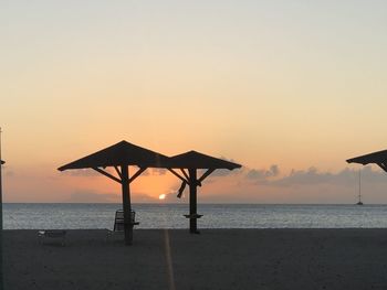 Scenic view of beach against sky during sunset