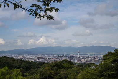 High angle view of city against cloudy sky