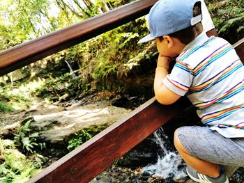 Side view of boy in deep thought