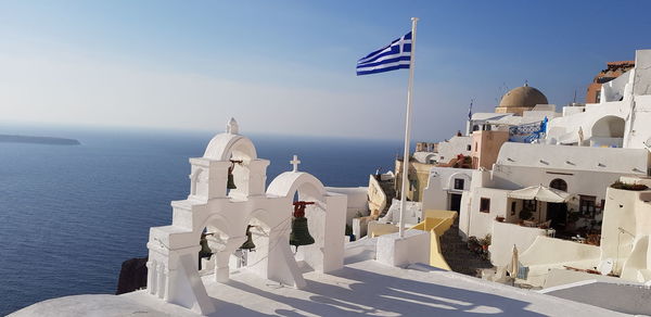 Panoramic view of sea and buildings against sky