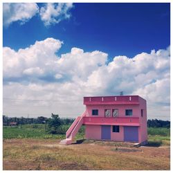 Built structure on landscape against sky