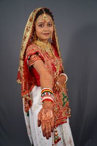 Portrait of smiling woman showing henna tattoo