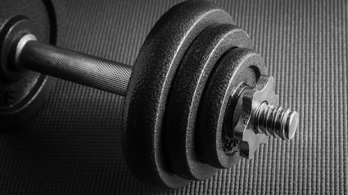Close-up of dumbbells in gym