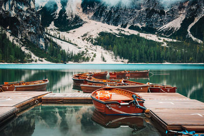 Boats moored in lake