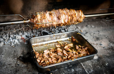 High angle view of meat on barbecue grill