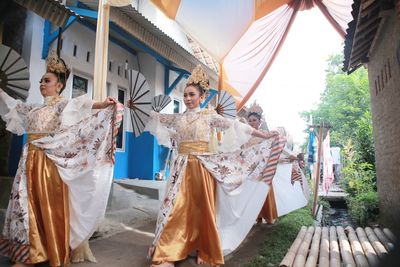 Panoramic view of people in traditional clothing