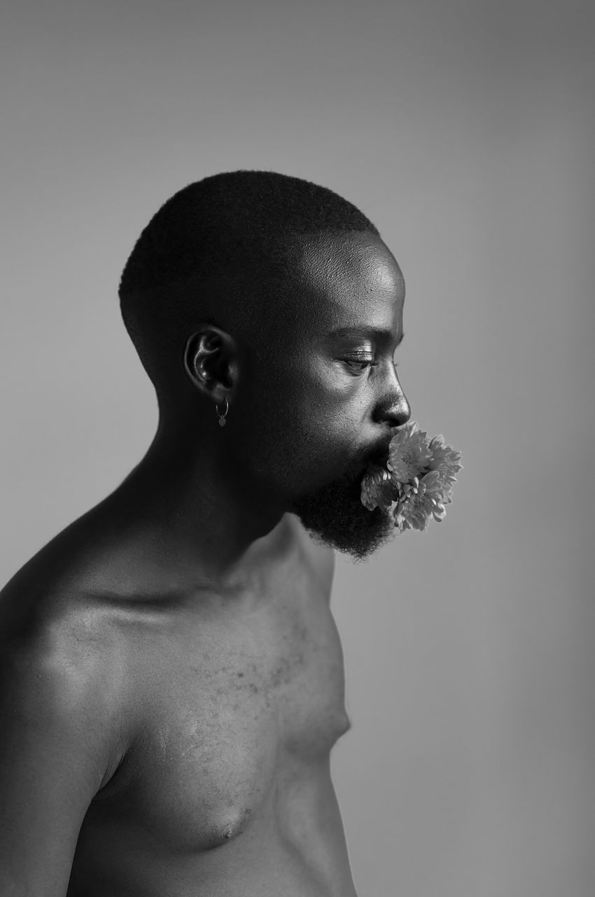 studio shot, one person, shirtless, indoors, young men, young adult, looking, looking away, portrait, beard, facial hair, men, lifestyles, males, waist up, cut out, headshot, standing, contemplation, masculinity