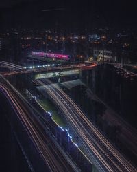 High angle view of light trails on road at night