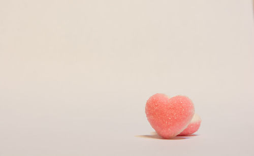 Close-up of heart shape over white background