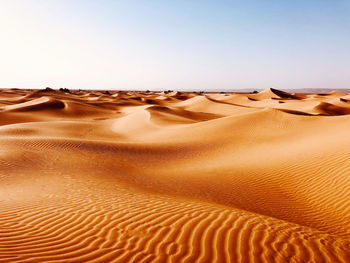 Scenic view of desert against clear sky