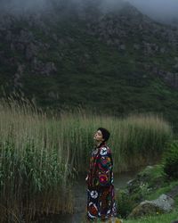 Rear view of man standing on field