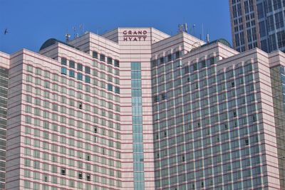 Low angle view of modern buildings against sky in city