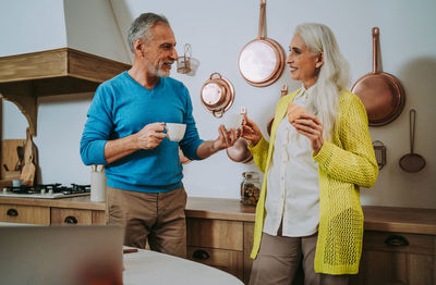 Midsection of woman standing by food