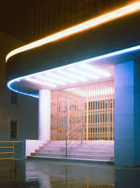 Low angle view of illuminated building in city at night