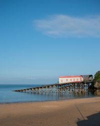 Scenic view of beach against blue sky