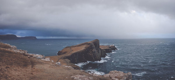 Scenic view of sea against cloudy sky