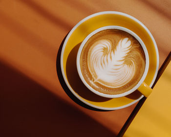 Close-up of cappuccino on table