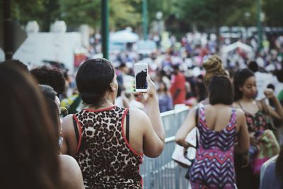 Rear view of people photographing