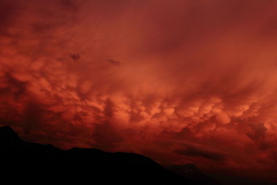 Low angle view of dramatic sky during sunset