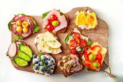 High angle view of various fruits on cutting board