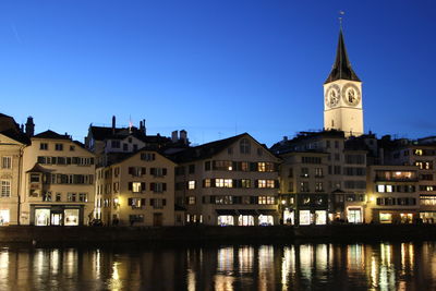 View of illuminated buildings in city