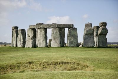 Built structure on field against sky