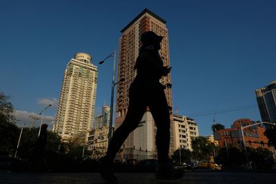 Low angle view of buildings against blue sky