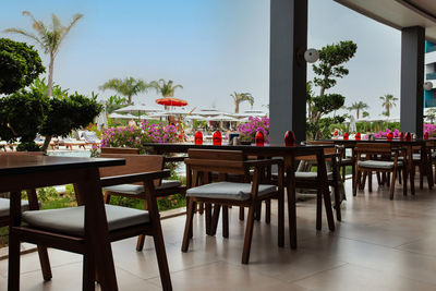 Empty chairs and tables in restaurant