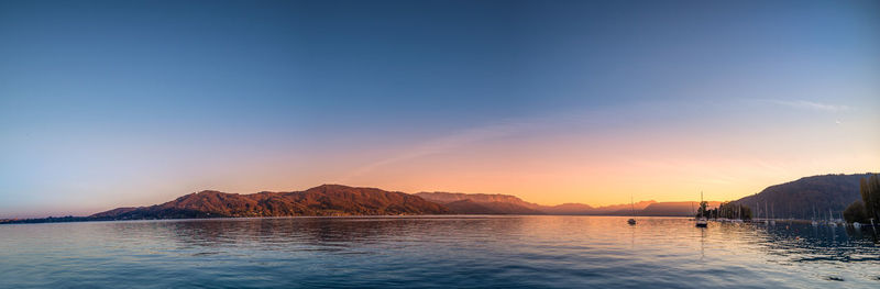 Scenic view of lake against sky during sunset