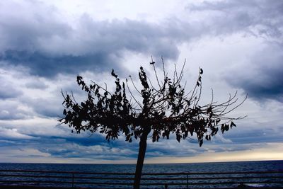 Scenic view of sea against cloudy sky