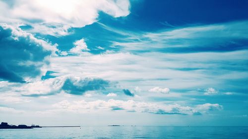 Scenic view of sea against cloudy sky