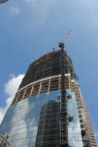 Low angle view of modern buildings against sky