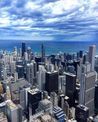 High angle view of cityscape against cloudy sky