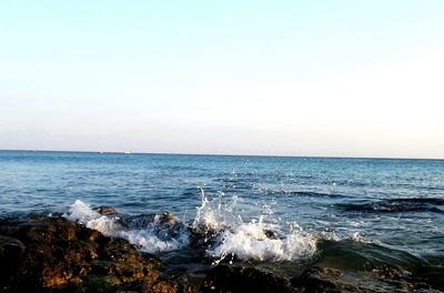 Scenic view of sea against clear sky