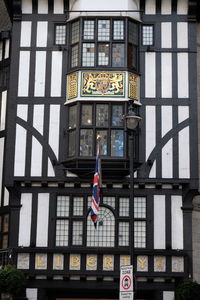 Low angle view of man flag in city