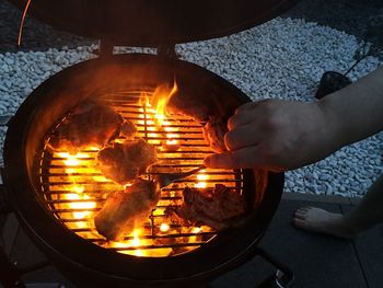 Man preparing food on barbecue grill