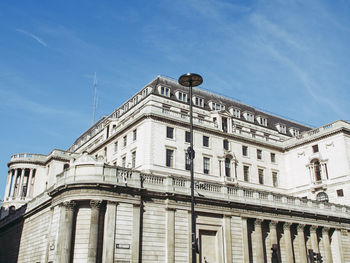 Low angle view of building against blue sky