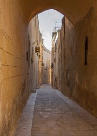 Narrow alley along buildings