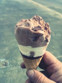 Cropped hand holding ice cream