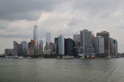 City skyline against cloudy sky